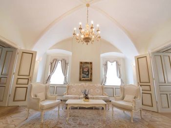 Seat with chandelier in the suite
