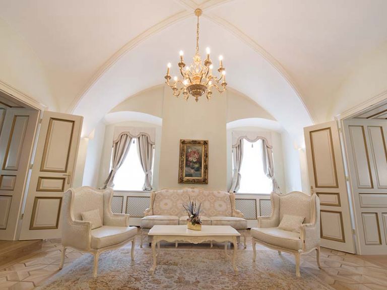 Seat with chandelier in the suite